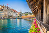 Wooden bridge with flowers over a river in a European city