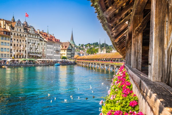 Wooden bridge with flowers over a river in a European city