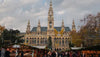 Historic building with Christmas market stalls in front, Vienna, Austria