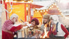 People gathered around a fire pit at a winter market.