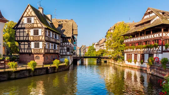 Canal with half-timbered houses on both sides in a picturesque European town.
